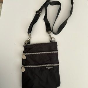 Gray small Baggallini Bag with hot pink inside.